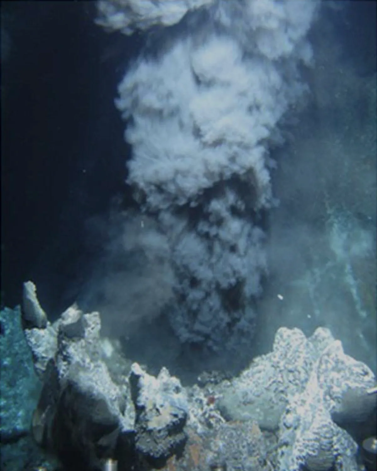 A black smoker hydrothermal vent rising from the deep ocean floor